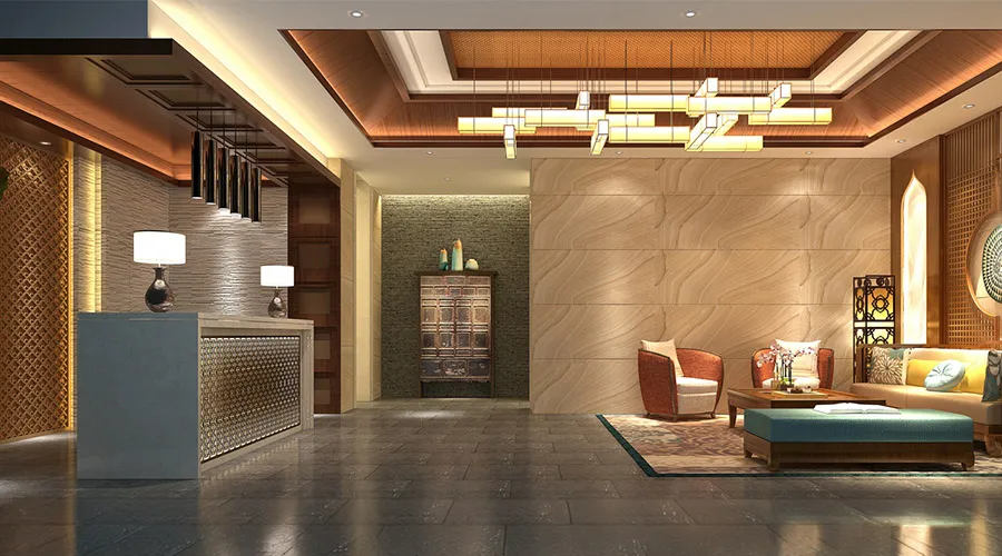 Reception hotel con bancone illuminato, lampade decorative e area lounge
